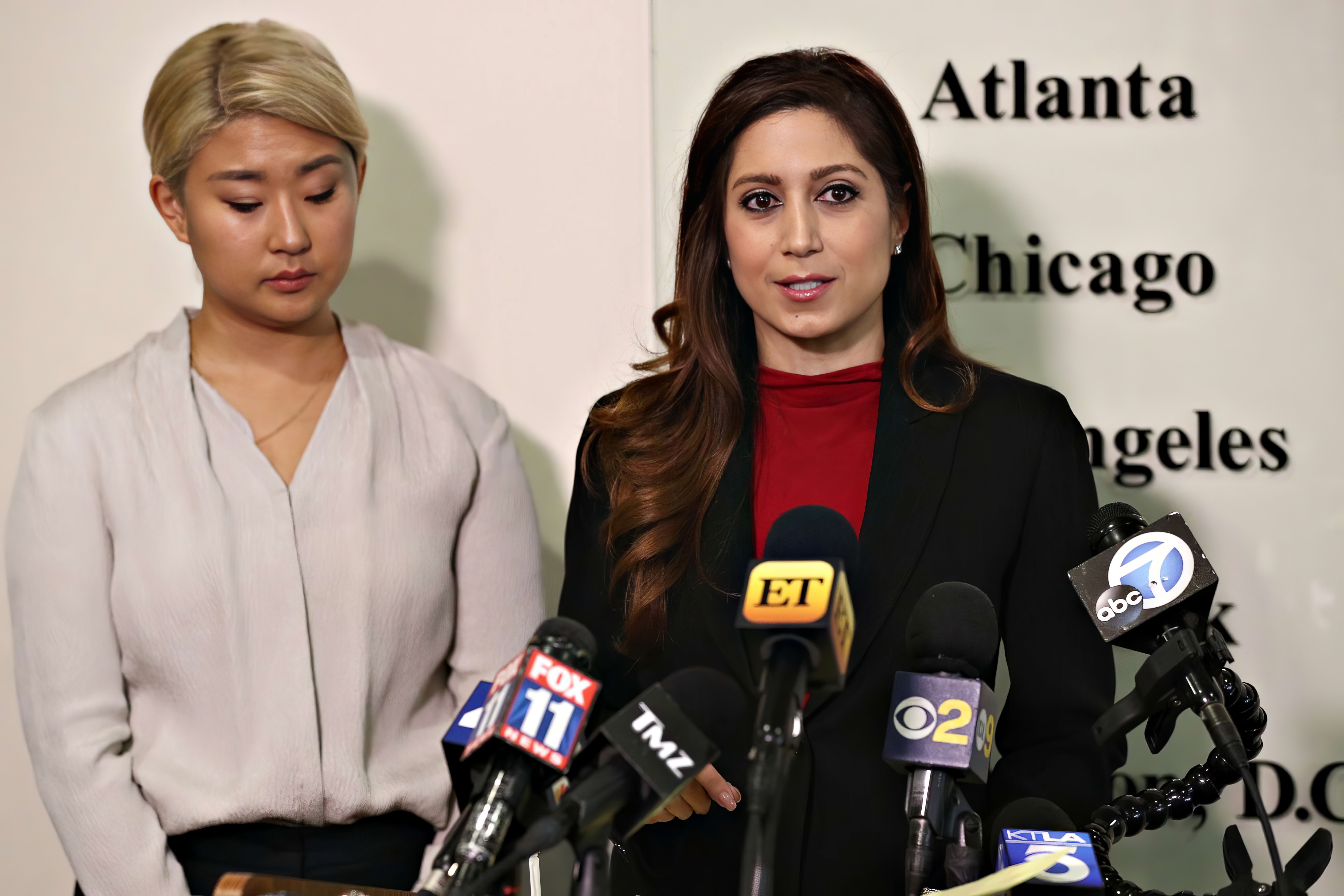 Anahita Sedaghatfar speaking at a press conference on behalf of a client, before microphones from FOX 11, TMZ, ET, CBS 2, ABC7, and KTLA 5