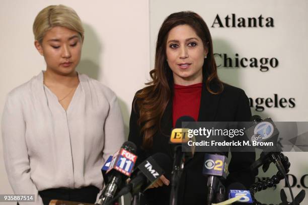 Anahita Sedaghatfar speaking at a press conference into a bank of national news microphones